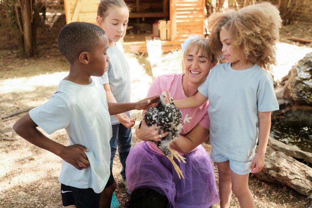 Teacher Taryn doing petting zoo with the kids